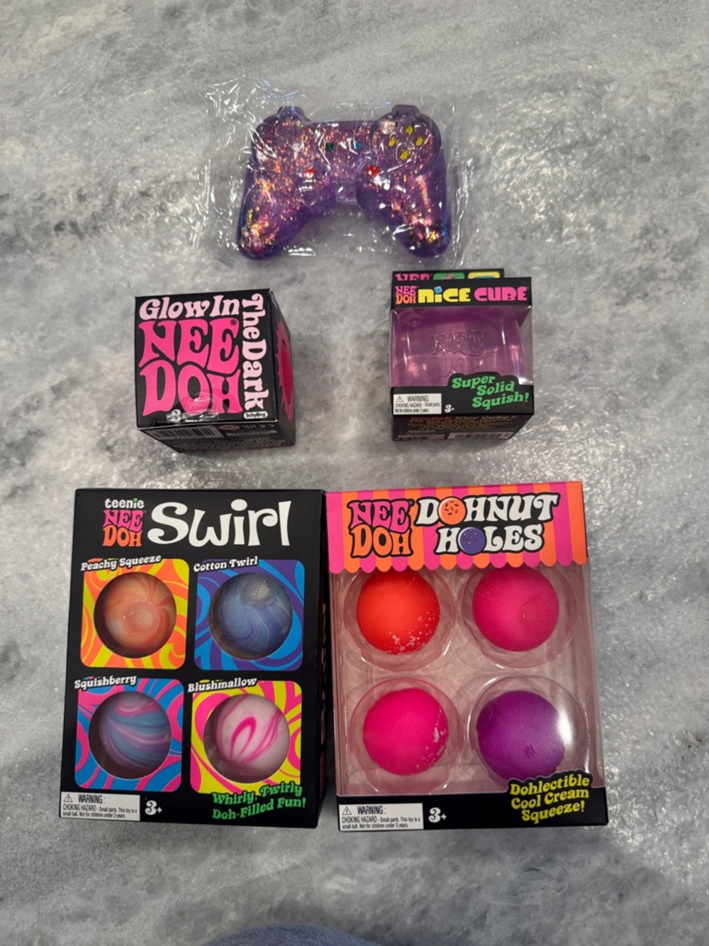 NeeDoh Donut Holes 4-Pack Squeeze Toys - Pink/Red/Purple